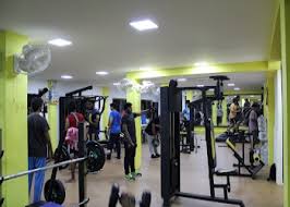 Flex Gym member training with trap bar deadlift